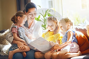 Mom and children reading a book