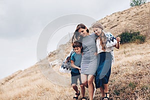 Mom with children walking outdoor