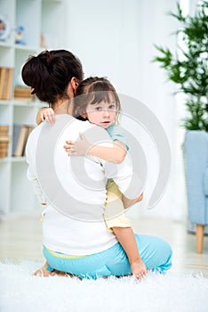 Mom consoles her crying daughter. Don`t worry, do not cry