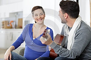 Mom and dad play music and sing song together