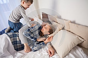 Mom dad and young son in the bedroom after sleeping House