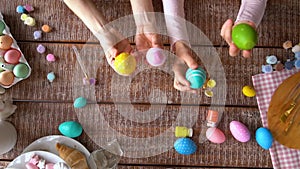 Mom and daughter decorating Easter eggs.