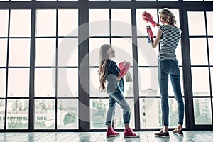 Mom with daughter doing cleaning