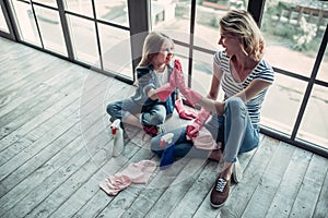 Mom with daughter doing cleaning