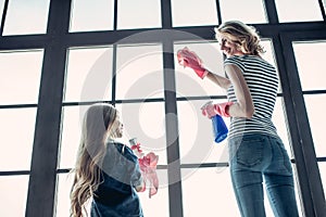 Mom with daughter doing cleaning