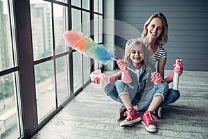 Mom with daughter doing cleaning