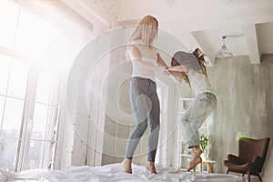 Mom and daughter having fun at home