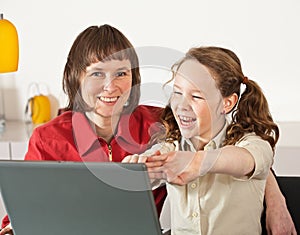 Mom and daughter with laptop