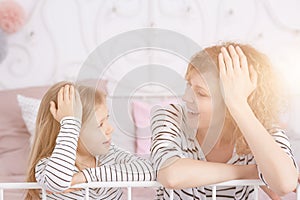 Mom and daughter laughing