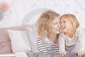 Mom and daughter laughing