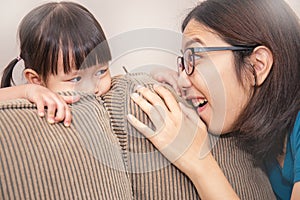 Mom and daughter play hide and seek