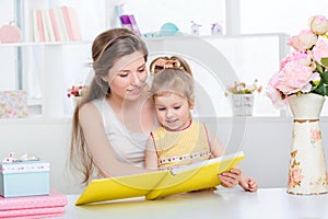 Mom and daughter reading together