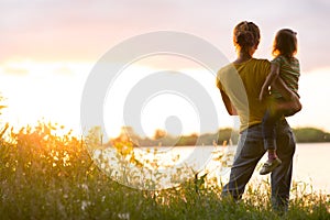 Mom and daughter on the river