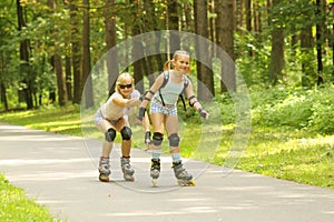 Mom and daughter ride on roller skates