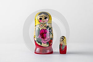 Mom and daughter Russian dolls on a white background. Traditional Russian wooden toys