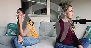 Mom and daughter sit separately expressing dissatisfaction after quarrel