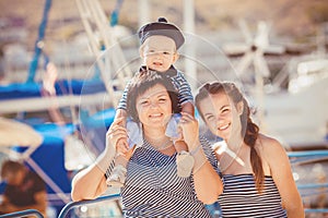 Mom, daughter and son rest in the summer on the beach