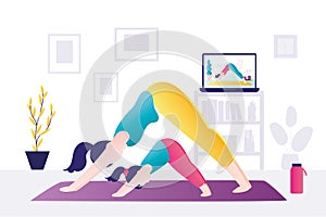 Mom and daughter stand in yoga pose, downward - facing dog. Woman and kid practice yoga together. Remote sports activities. Family