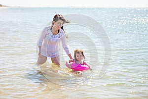 Mom and daughter swimming