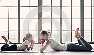 Mom with daughter working out at home