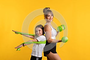 Mom and daughter workouts in studio