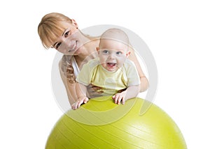 Mom doing exercises on a fit ball with baby.