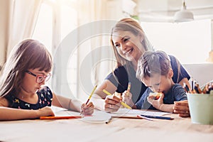 Mom drawing with her children