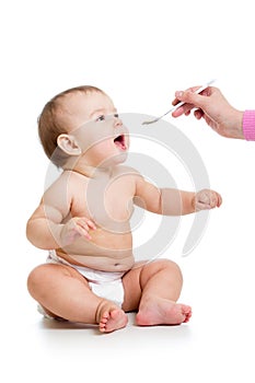 Mom feeding baby with a spoon