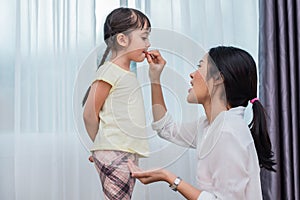 Mom feeding kids with potato chip. Teacher feeding student with