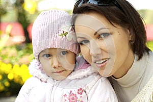 Mom and girl in the autumn