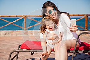 Mom and girl taking a selfie