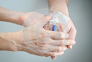 Mom hands holding her son hand