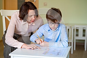 Mom helps son to do homework. teacher deals boy.