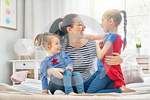 Mom and her daughters are playing