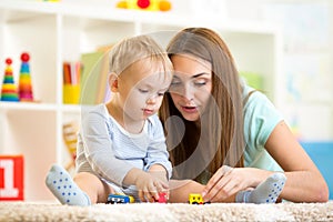 Mom with her kid son play together