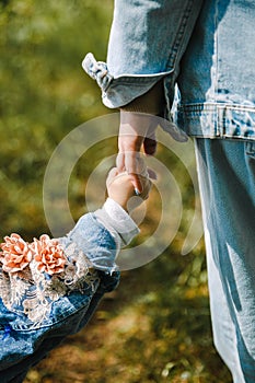 Mom holding baby`s hand