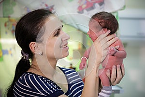 Mom holds a newborn baby