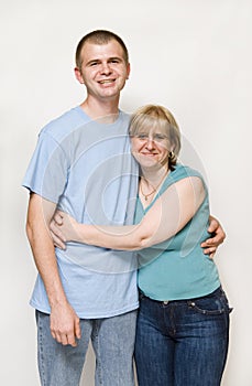 Mom hugging adult son