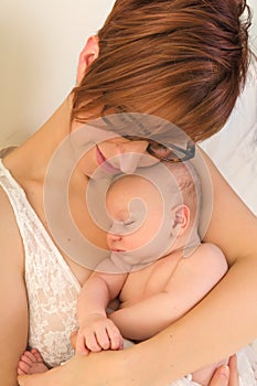 Mom hugging baby