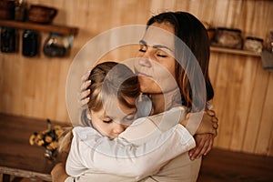 Mom hugs daughter. Happy family on mpthers day. Love mothers and daughters