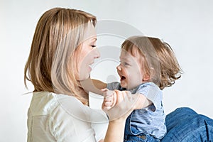 Mom and kid having fun pastime. Parenthood