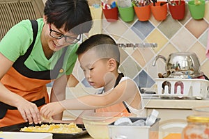 Mom and kid making pizza