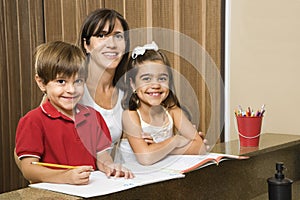 Mom and kids with homework.