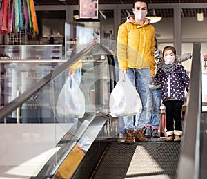 Mom and kids are shopping at the grocery store