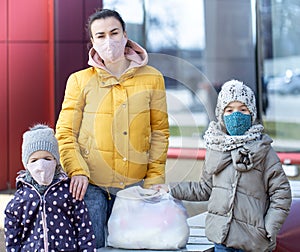 Mom and kids are shopping at the grocery store