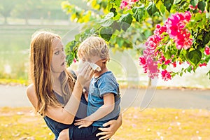 Mom looks at his son who is allergic to pollen