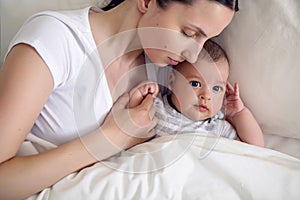 Mom with a newborn son lying