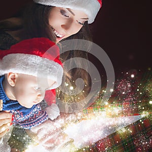 Mom opens the magic box with a gift for child