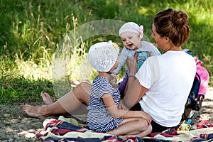 Mom playing with her children