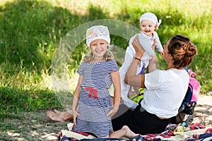 Mom playing with her children